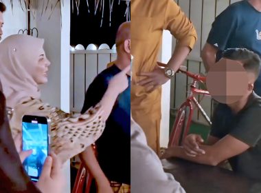 Seorang wanita menunjuk ke arah seorang lelaki yang duduk di meja, dipercayai kakitangan homestay, sambil dikelilingi beberapa individu lain.