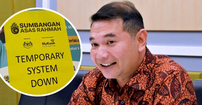 Rafizi Ramli bercakap dengan latar visual poster Sumbangan Asas Rahmah yang memaparkan notis sistem tergendala.