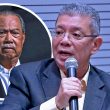 Saifuddin Abdullah bercakap sambil memegang mikrofon, dengan wajah Muhyiddin Yassin kelihatan di latar belakang dalam bentuk bulatan.