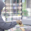 Wanita bertudung keluar mengundi di pusat pengundian